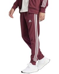 adidas - Essentials French Terry Poignets fuselés 3 Bandes Joggers - Lyst