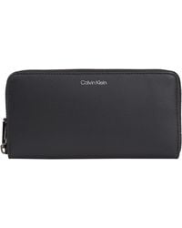 Calvin Klein - Concise Long Zip Around Wallets - Lyst