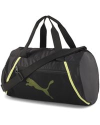 PUMA - Sporttasche at ESS Barrel Bag 077365 Black-Soft Fluo Yellow One Size - Lyst