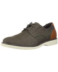 skechers lace up hombre marron