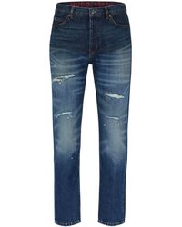 HUGO - 634 Blaue Tapered-Fit Jeans aus festem Denim Blau 34/34 - Lyst