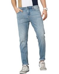 Celio* - Jeans da uomo blu tinta unita slim fit in twill di cotone elasticizzato denim - Lyst