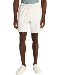 Calvin Klein - Uomo Pantaloncini in Felpa Logo Tape Relaxed Fit - Lyst