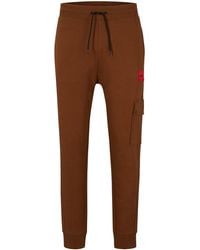 HUGO - Relaxed-fit Tracksuit Bottoms With Red Logo Label - Lyst