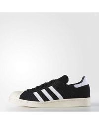 superstar 80s primeknit mens gold