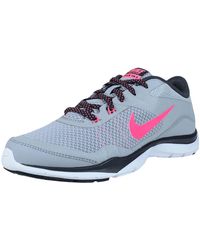 nike training flex trainers in grey with peach swoosh