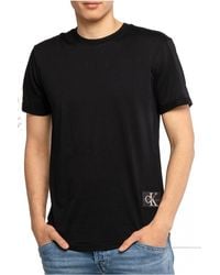 Calvin Klein - Badge Turn Up Sleeve J30j323482 S/s Knit Tops - Lyst