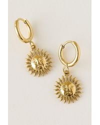 By Anthropologie - Water-Resistant Sun Huggie Hoop Earrings - Lyst