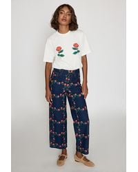 The Tiny Big Sister - Floral Embroidered Wide-Leg Jeans - Lyst