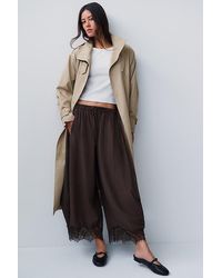 By Anthropologie - Reverie Cropped Lace-Hem Trousers - Lyst