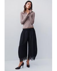 By Anthropologie - Reverie Cropped Lace-Hem Trousers - Lyst