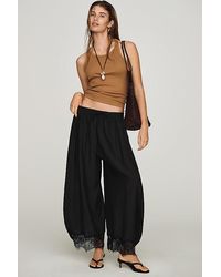 By Anthropologie - Reverie Cropped Lace-Hem Trousers - Lyst