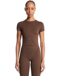 Nike - Skims Cropped Corset T-Shirt - Lyst