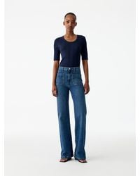 ARKET - Spruce Flared Jeans - Lyst