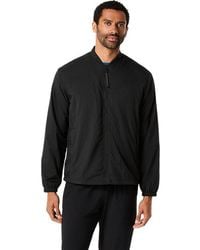 Asics - ACTIADAPT PACKABLE JACKET - Lyst