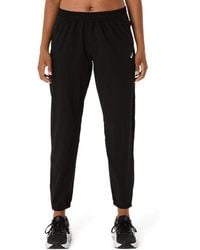Asics - CORE WOVEN PANT - Lyst