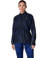 Asics - ROAD LITE-SHOW PACKABLE JACKET - Lyst
