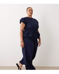 ASOS - Asos Design Curve Jumpsuit With Peplum And Balloon Legs - Lyst