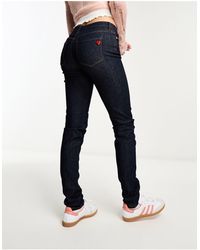 Love Moschino - Jeans skinny lavaggio scuro con borchia a forma di cuore - Lyst