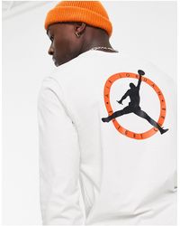 Nike - Maglietta a maniche lunghe bianca con logo - Lyst