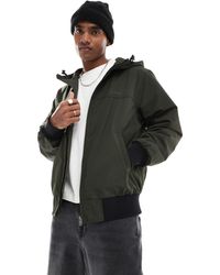 Superdry - Surplus - bomber à capuche en nylon - olive surplus goods - Lyst