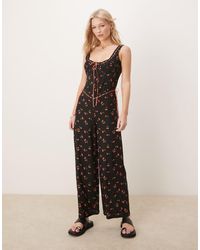 ASOS - Mono Largo Negro Abotonado De Pernera Ancha Con Vuelo Y Y Ribete De Encaje De - Lyst