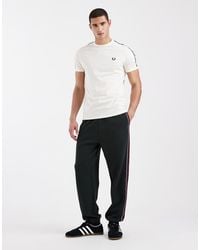 Fred Perry - Stripe Tape Logo Track Pants - Lyst