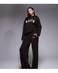 Kaiia - Wool Feel Knitted Embroidered Logo Wide Leg Pants - Lyst