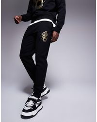 ARMANI EXCHANGE - Lunar Capsule Snake joggers - Lyst