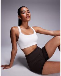 4505 - Seamless Sculpting Medium Support Sports Bra - Lyst