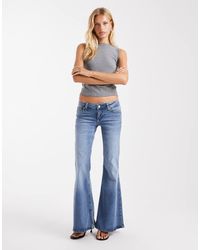 ASOS - Vaqueros De Talle Muy Bajo Y Corte Acampanado Con Lavado Azul Pálido De - Lyst