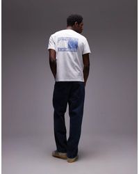 Tommy Hilfiger - T-Shirt Bianca E Blu Con Stampa Di Bandiera Con Motivo Cachemire Sul Retro - Lyst