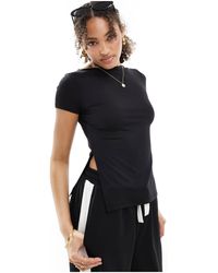 ONLY - T-shirt taglio lungo nera con maniche ad aletta e spacco laterale - Lyst