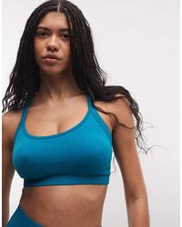 4505 - Sculpting Seamless Strappy Push Up Sports Bra With Removable Padding - Lyst