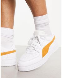 PUMA - Ca pro - sneakers bianche con dettagli gialli - Lyst