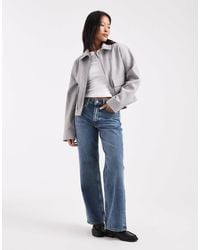 ASOS - Asos design petite – bequeme jeans mit geradem schnitt, stretchanteil und vintage-waschung - Lyst
