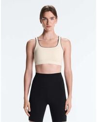 Oysho - Medium-support Comfortlux Sports Bra With Contrast Seams - Lyst