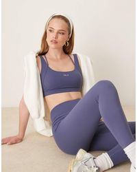 Tala - Sujetador Deportivo Azul De Tirantes Con Tiras Cruzadas En La Espalda Skinluxe De - Lyst
