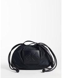 Calvin Klein - Nylon Drawstring Crossbody Bag With Bold Logo - Lyst