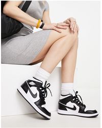 Nike - Air 1 mid - sneakers alte da donna bianche e nere - Lyst