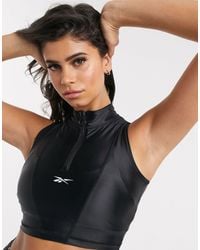 Reebok Sleeveless and tank tops for Women - Up to 61% off at Lyst.com