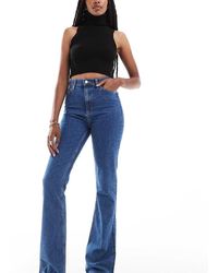 ASOS - Asos Design Tall Mid Rise Flare Jeans - Lyst