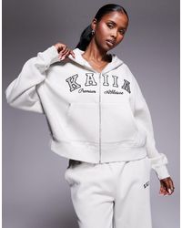 Kaiia - Sweat à capuche d'ensemble en coton majoritaire à fermeture éclair et broderie logo - clair - Lyst