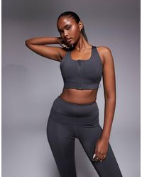 4505 - Icon Active High Support Sports Bra With Removable Padding And Adjustable Straps - Lyst