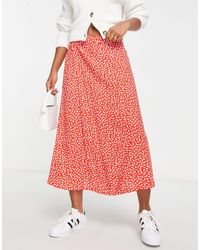 Satin wrap midi skirt Orange Monki Femme Vêtements Jupes Jupes asymétriques 