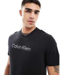 Calvin Klein - Jeans - t-shirt nera con logo sfumato - Lyst