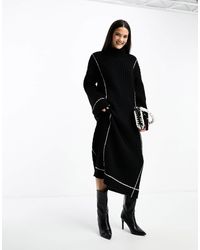 Y.A.S - Y.a.s - robe pull mi-longue en maille avec col montant et coutures contrastantes - Lyst