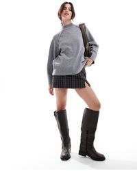 Stradivarius - – karierter skort mit saumschlitz - Lyst