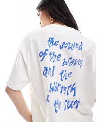 Bershka - T-shirt oversize bianca con stampa di stelle - Lyst