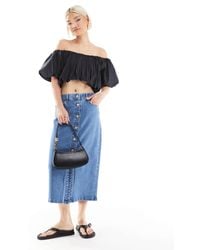 Vero Moda - Jupe en jean mi-longue avec boutons à l'avant - clair délavé - Lyst